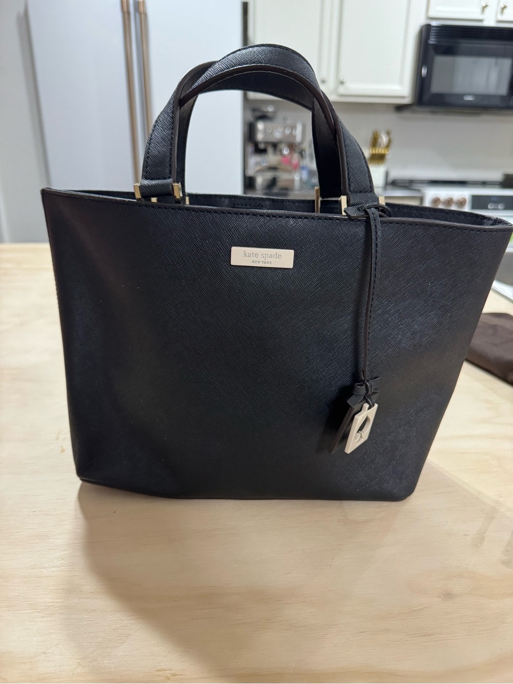 kate spade black saffiano tote with gold accents